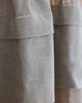 Coudre curtain extensions layered at the hem
